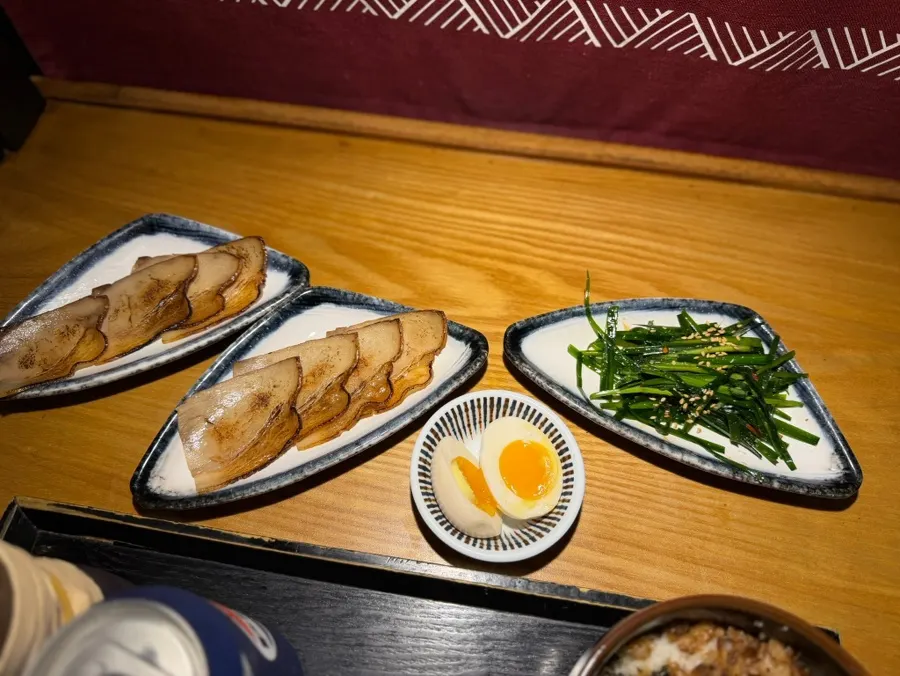 Noodles lifted from the tonkotsu broth