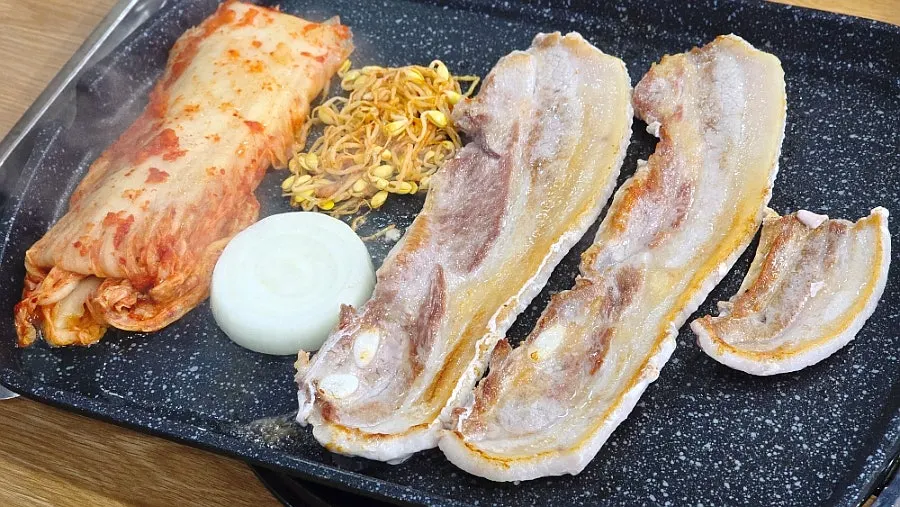 Plate of ordered raw pork belly, two servings