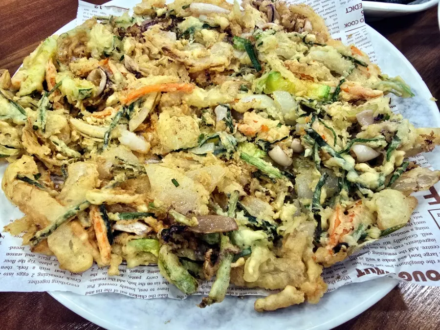 Cross-section of the seafood pancake with squid, shrimp, and vegetables