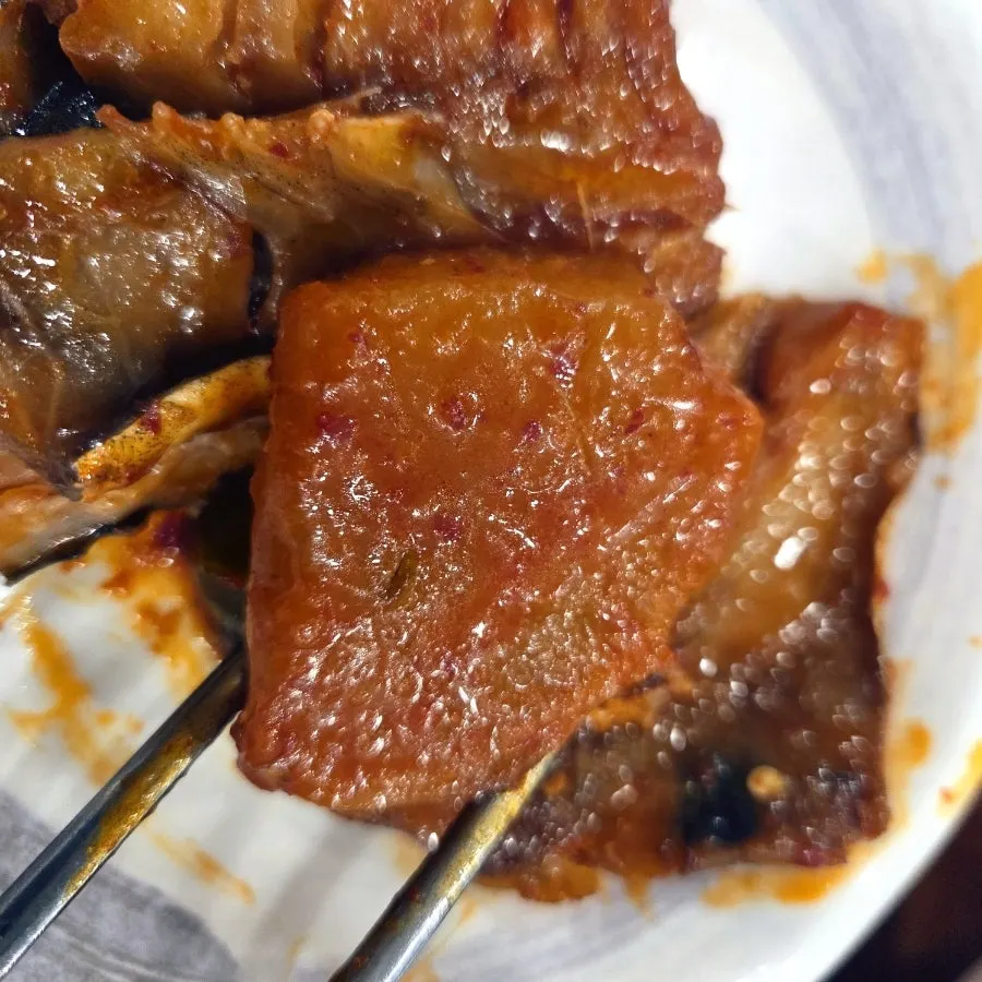 Close-up of the sauce-soaked braised pollock