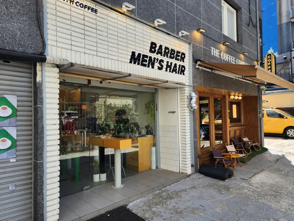 Full view of Coup Barber & Coffee shop from the alley
