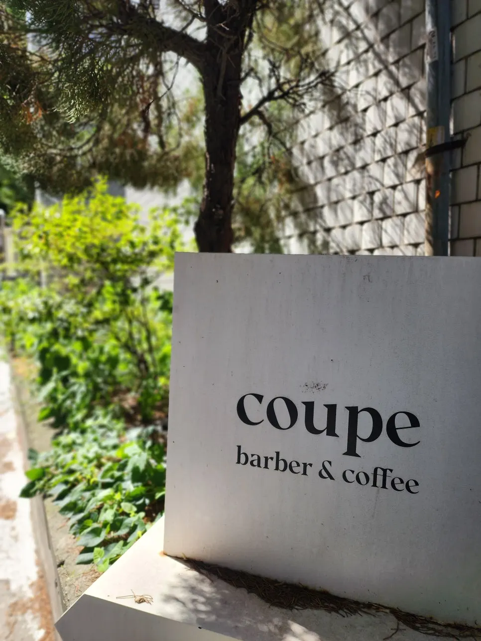 Sign for the men's-only barber shop in Apgujeong