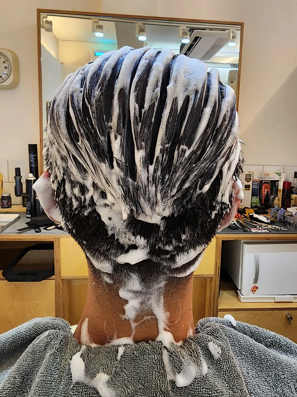 Scissor work cleaning up flyaways during the cut