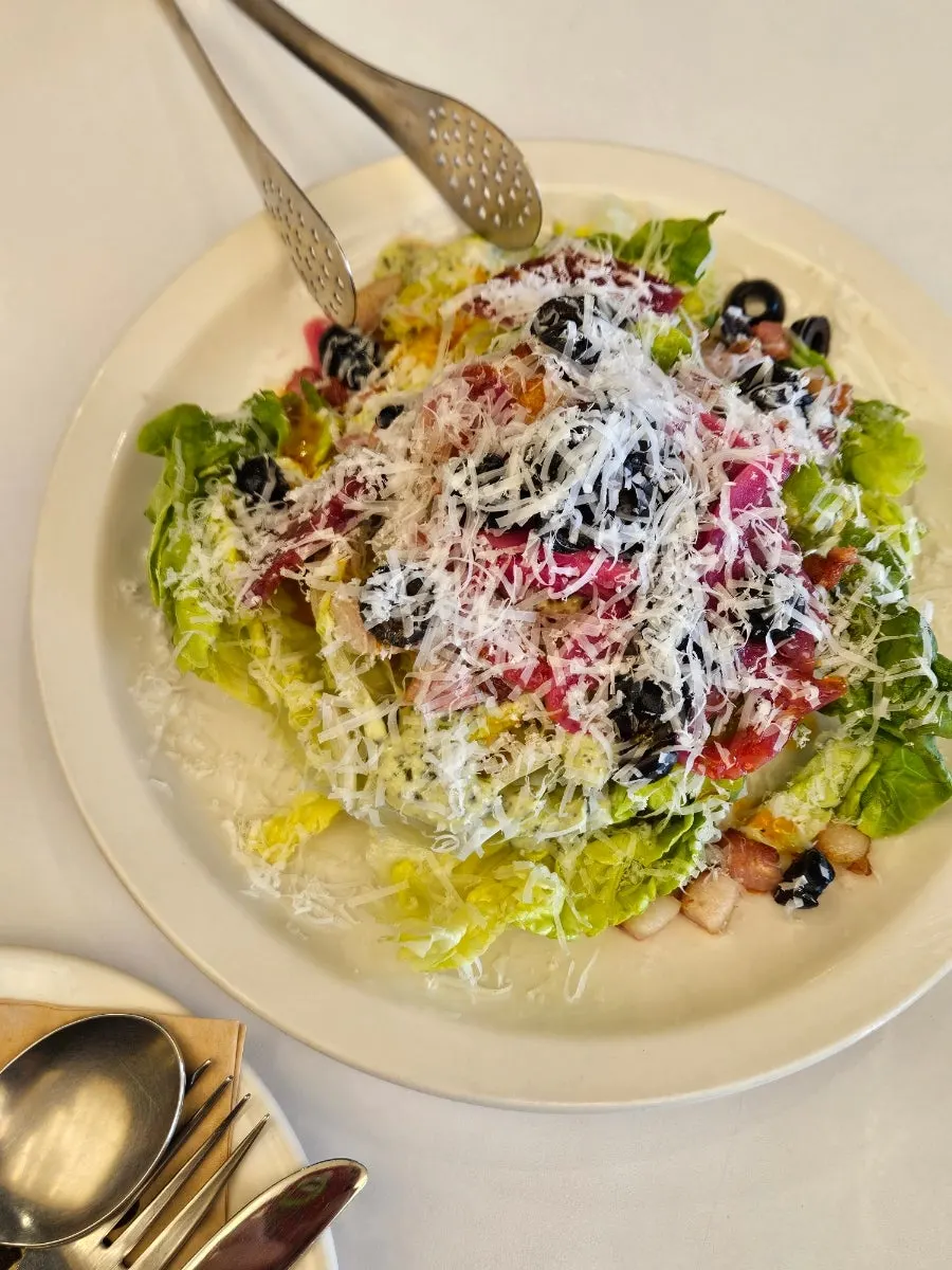 Romaine topped with wasabi dressing and olives