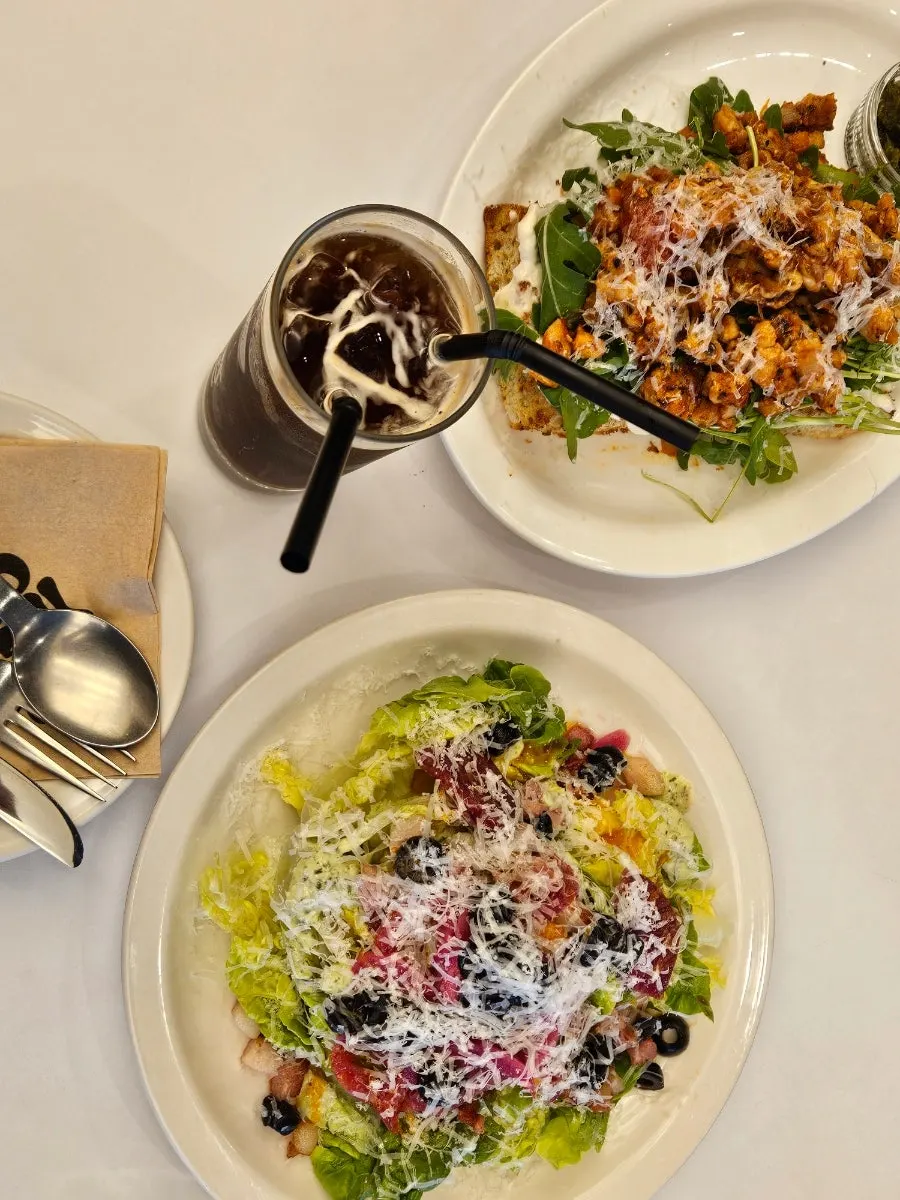 Picking up a bite of the romaine salad