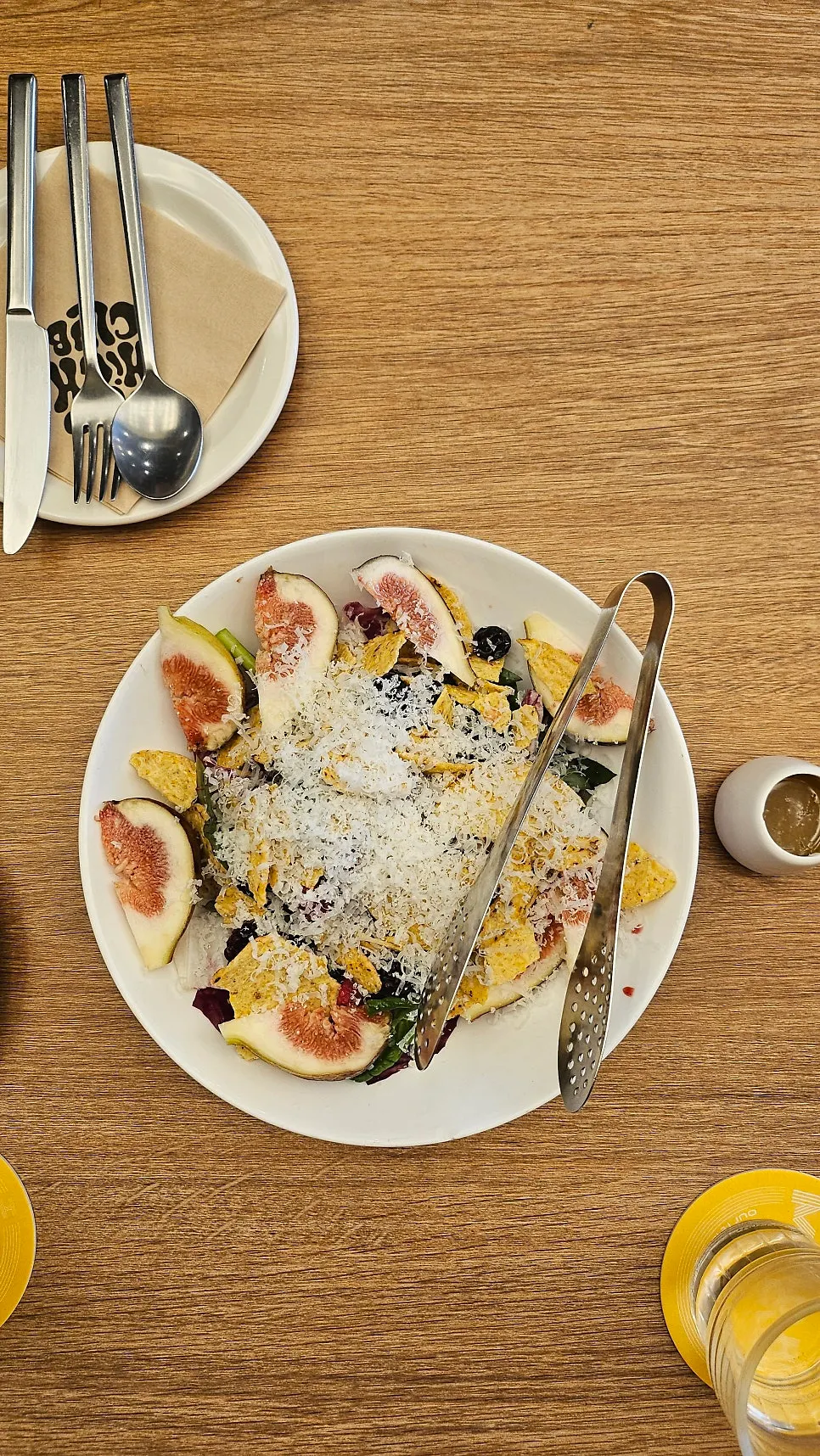 Seasonal salad topped with figs and raspberries