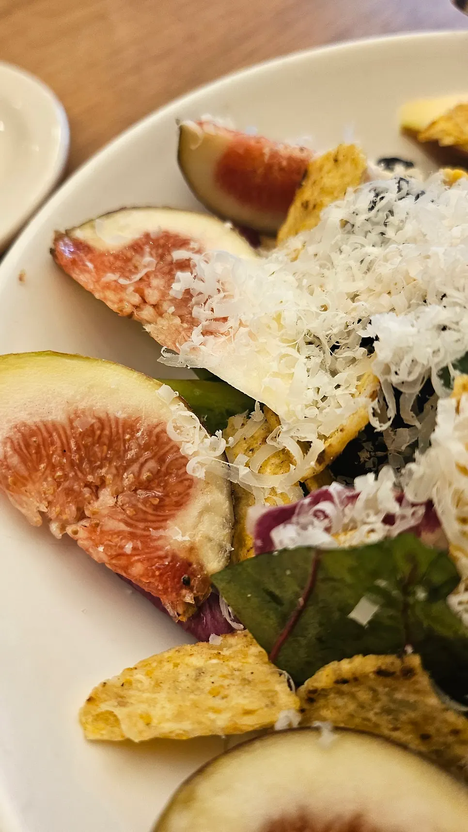 Close-up of the seasonal salad with nacho pieces