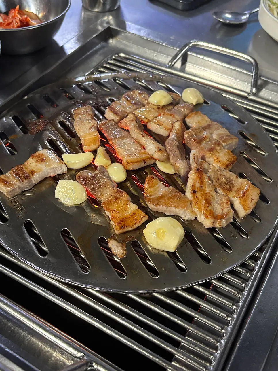 Outdoor meat-grilling table on a cool evening