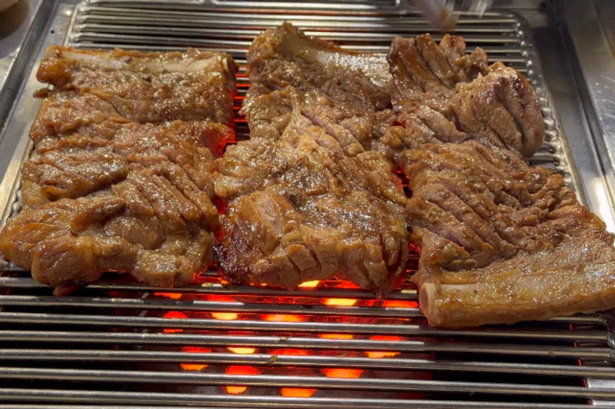 Pork king ribs over charcoal