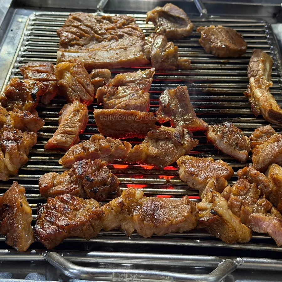 Pork king ribs covering the grill