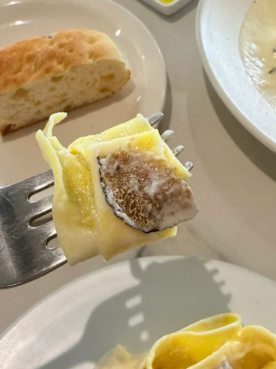 Truffle cheese-wheel tagliatelle