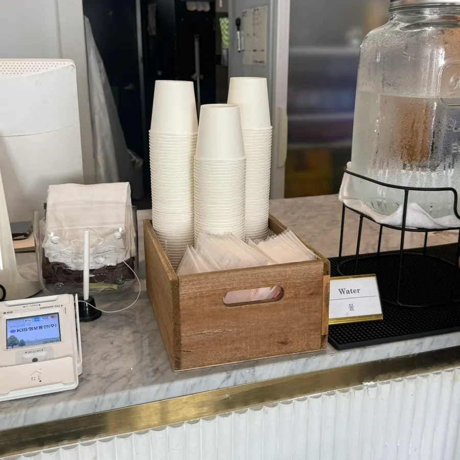 Disposable aprons and amenities near the ordering counter
