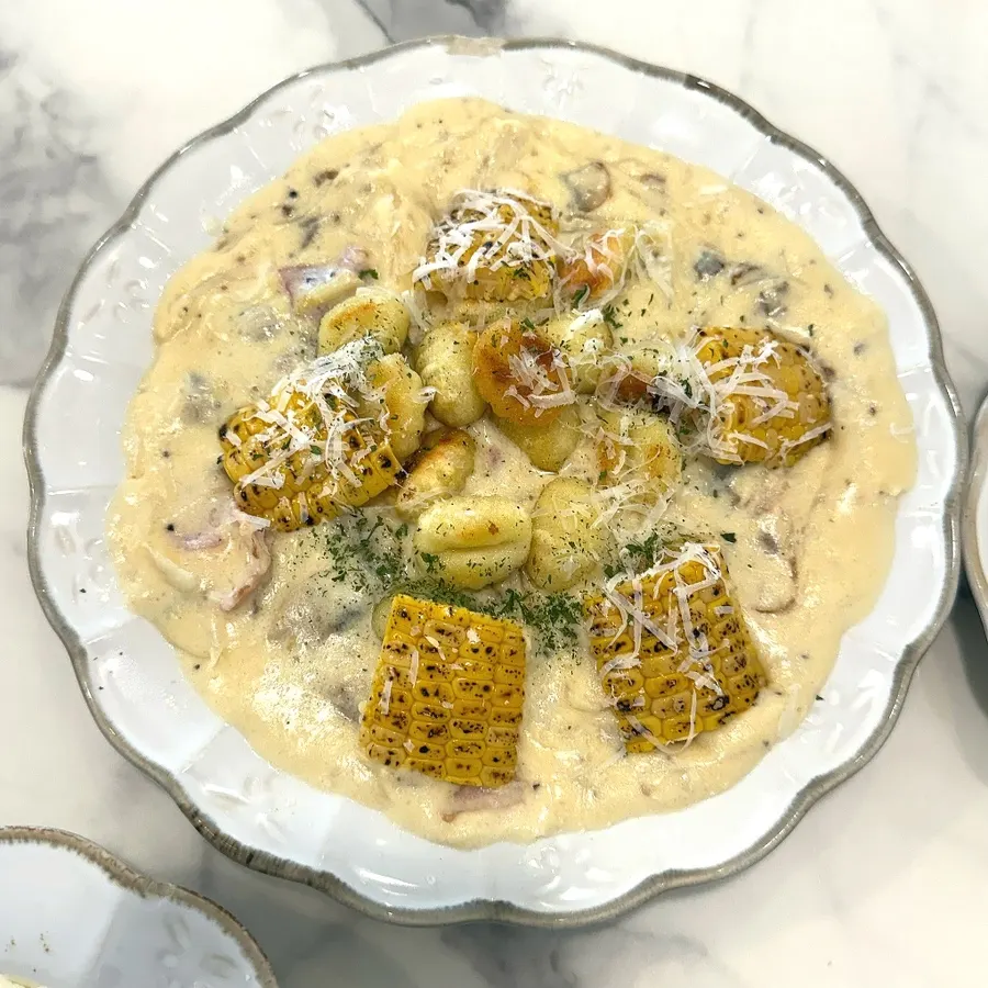 Yellow corn gnocchi topped with roasted corn