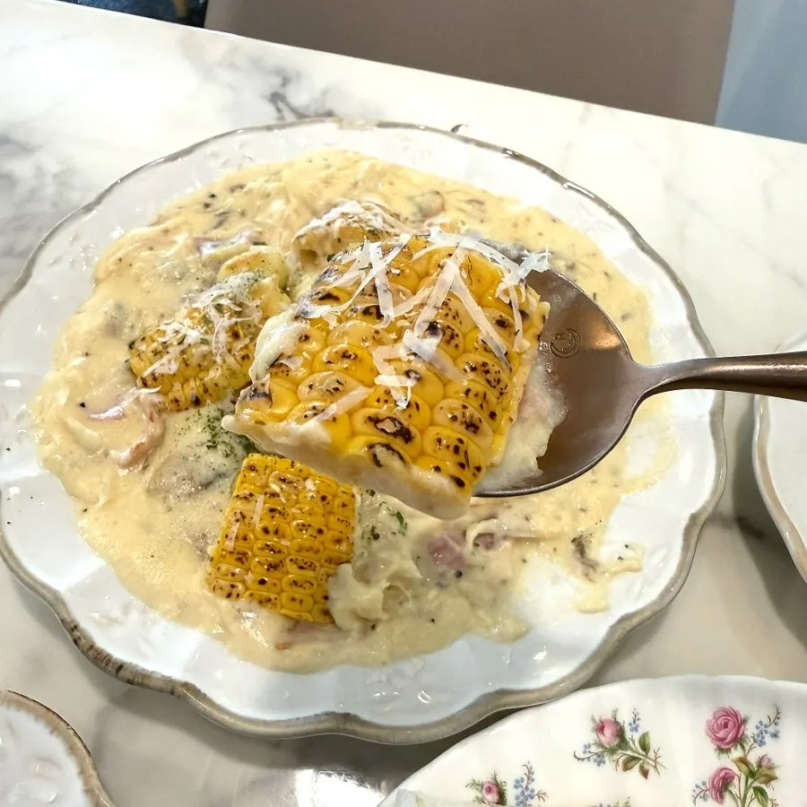 Corn gnocchi mixed with onion and bacon