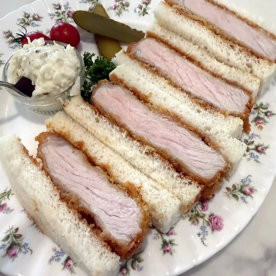 Cross-section of the katsu sando with a thick cutlet