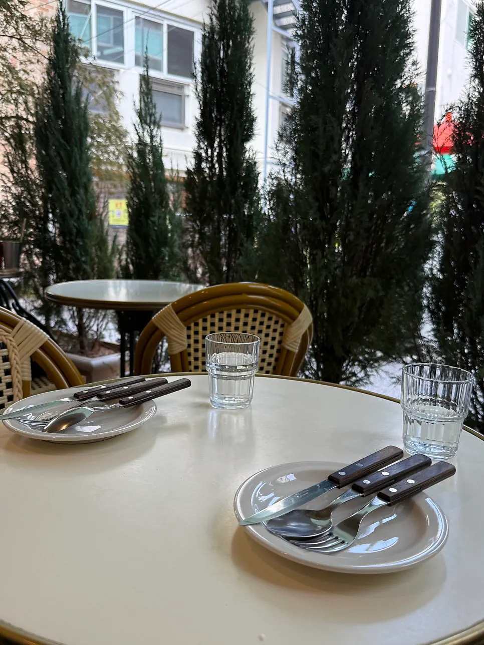 Terrace seating and table setting at Le Bon Goûter
