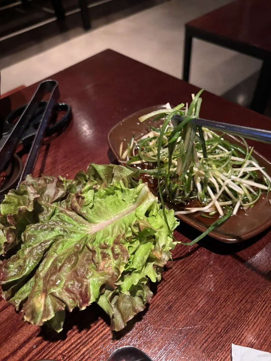 Basic spread of lettuce, perilla leaves, and scallion salad