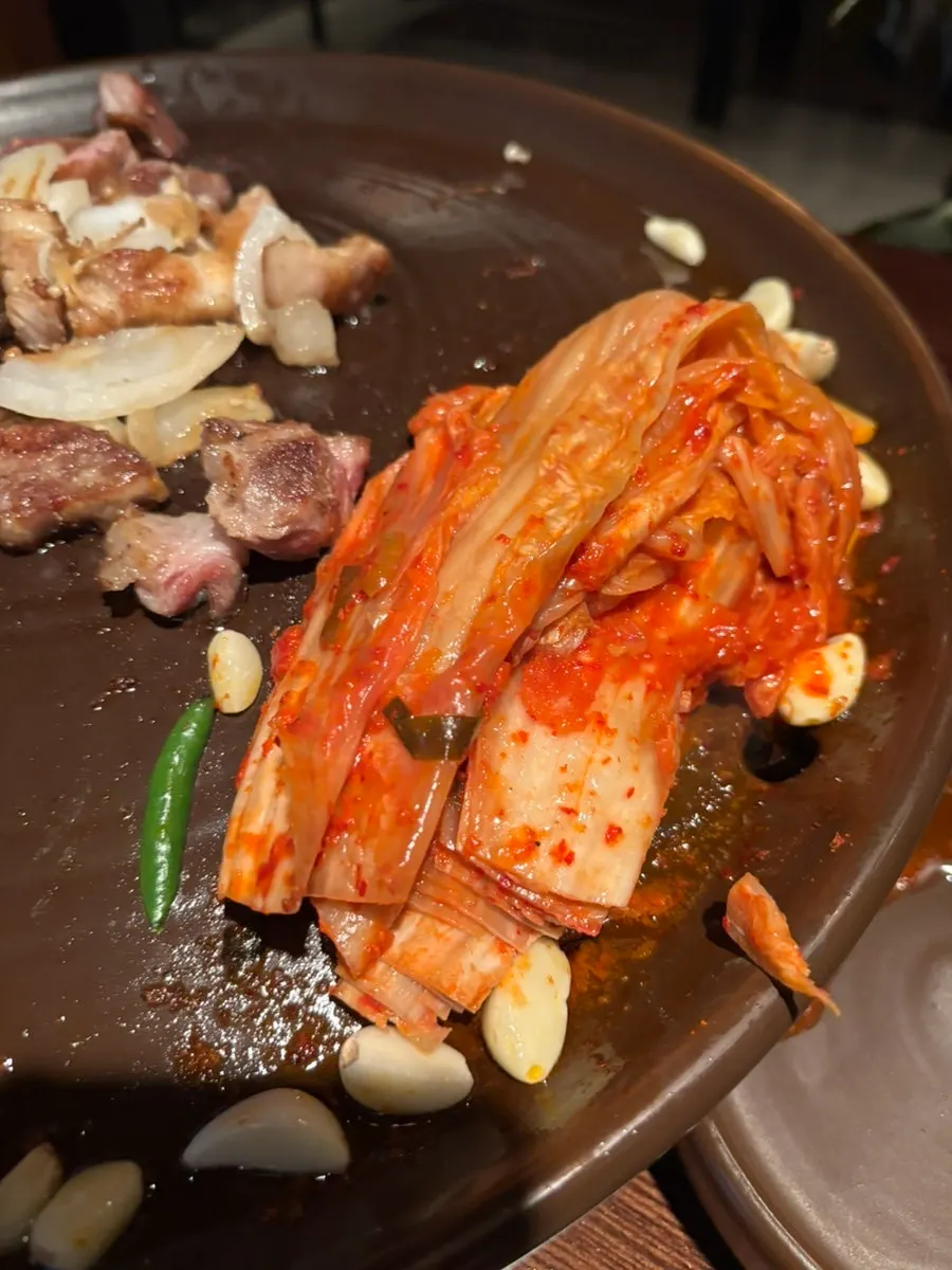 Grilled kimchi eaten with pork
