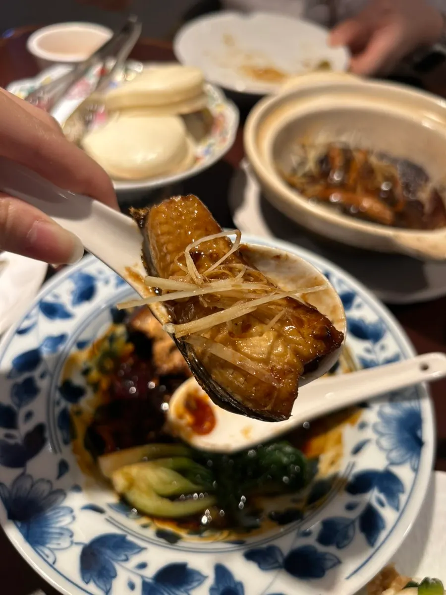 Taking a bite of dongpo pork