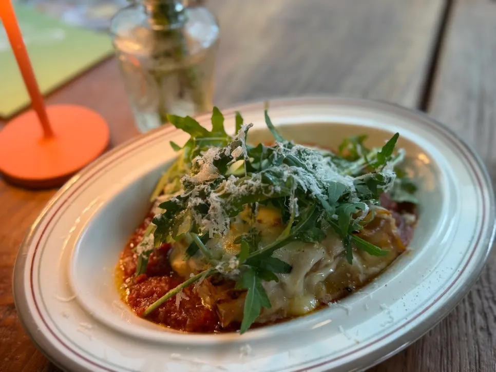 Lasagna showing its layers of pasta and sauce