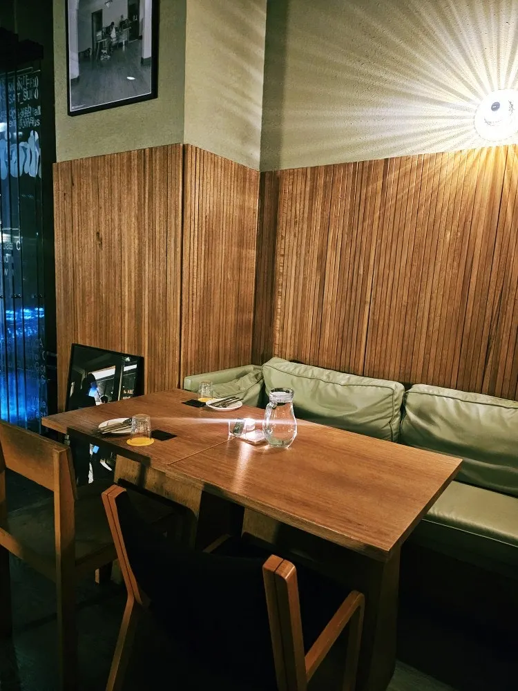 Sofa seating by the wall at Mild High Club