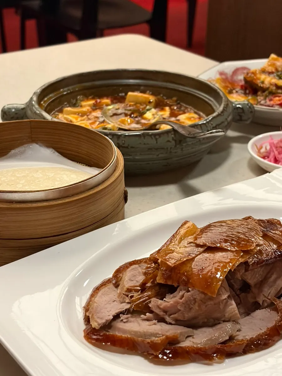 Peking duck pancake wrappers separated sheet by sheet with paper