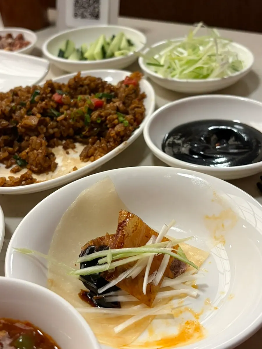 Peking duck wraps with scallion and cucumber