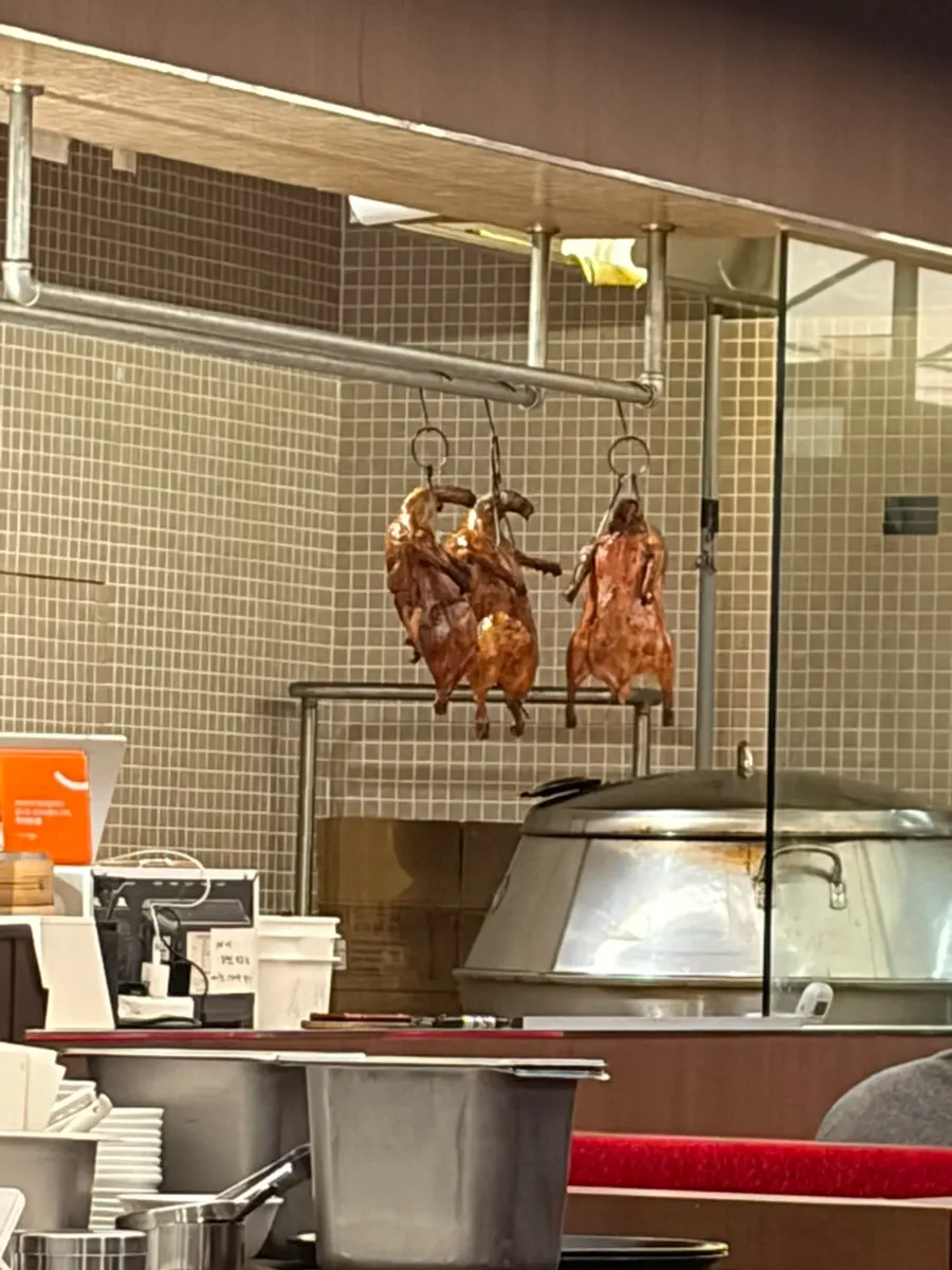 A full table spread of half Peking duck