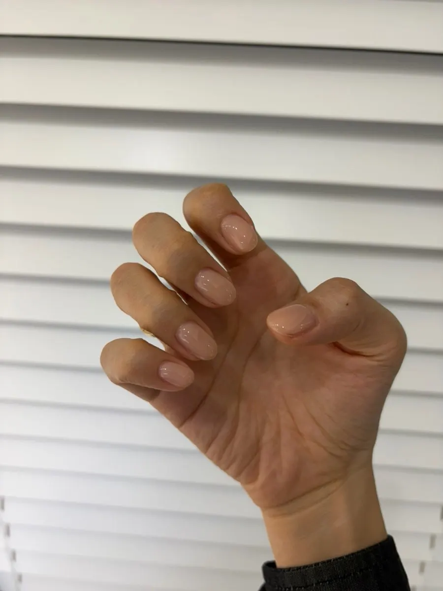 Nails painted in the nude one-color shade