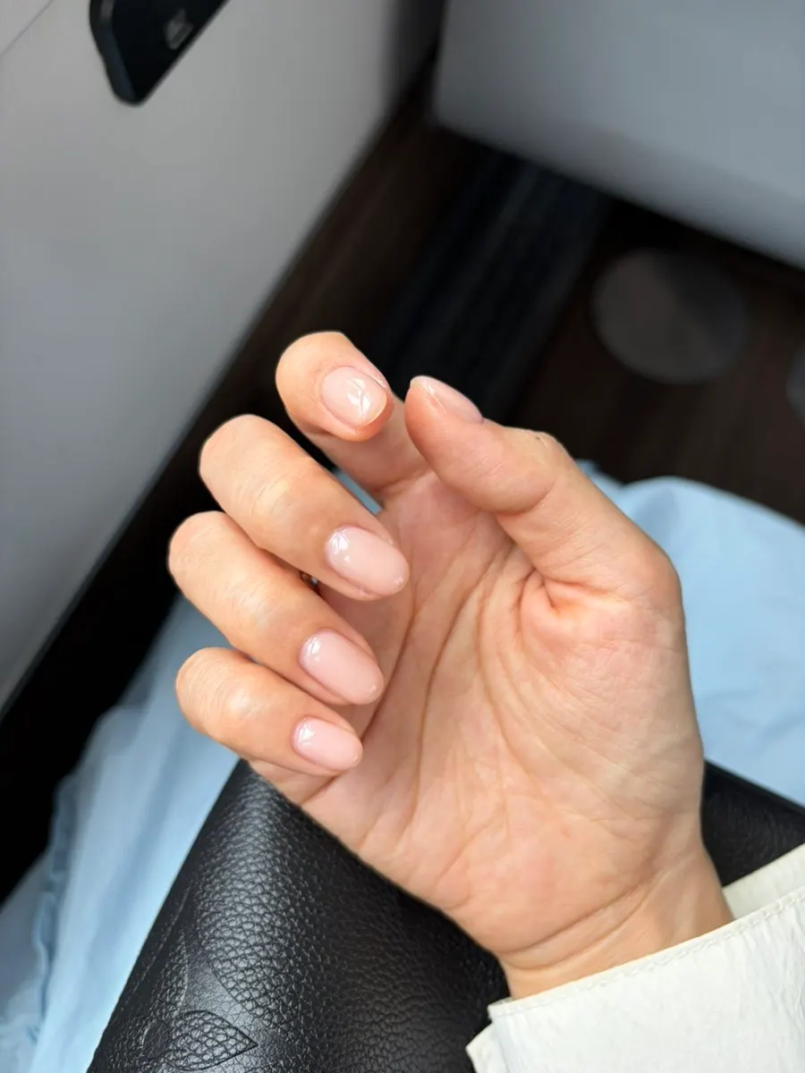 Nude one-color manicure seen in natural light