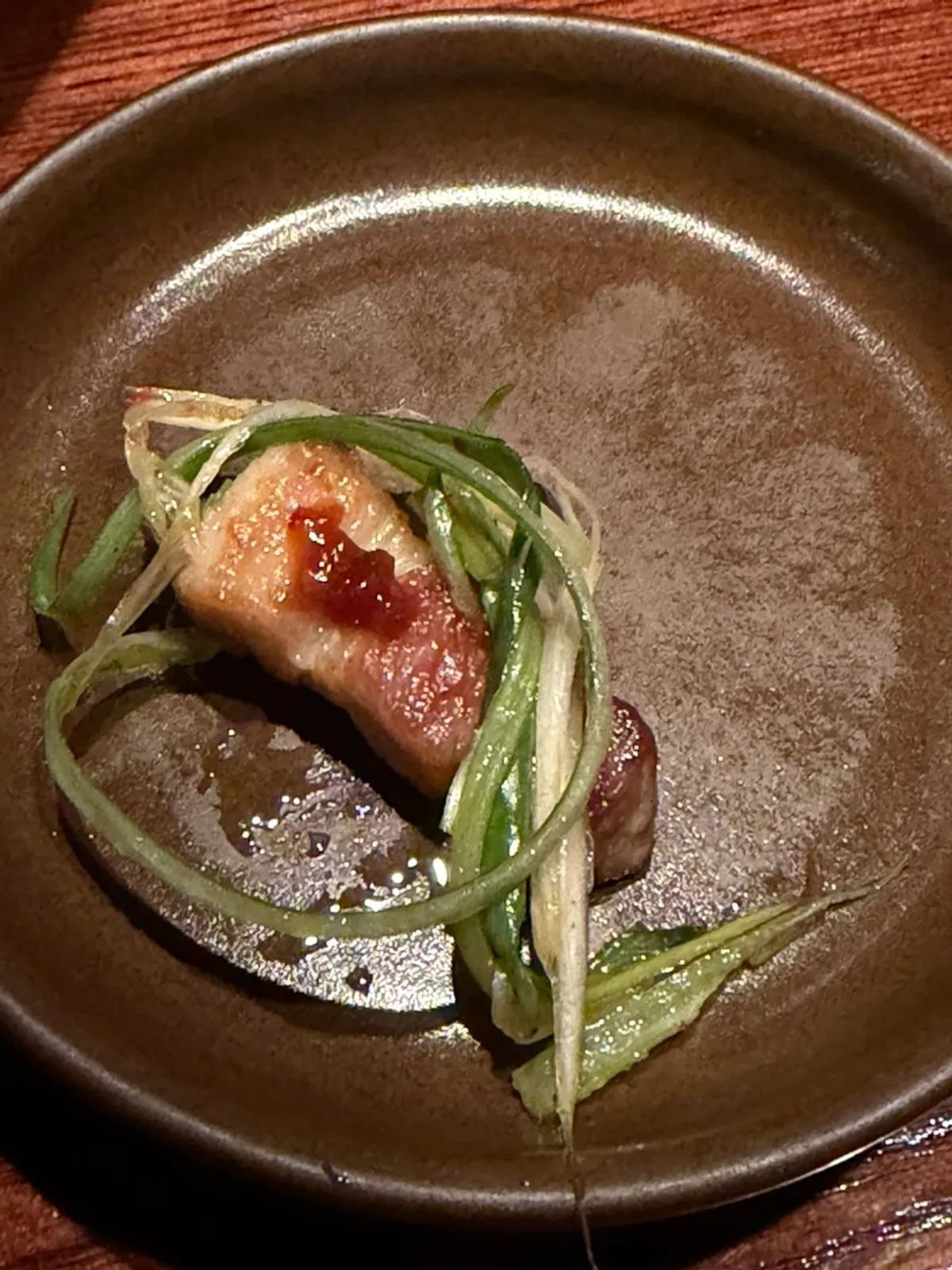 Par-grilled meat with shredded scallions