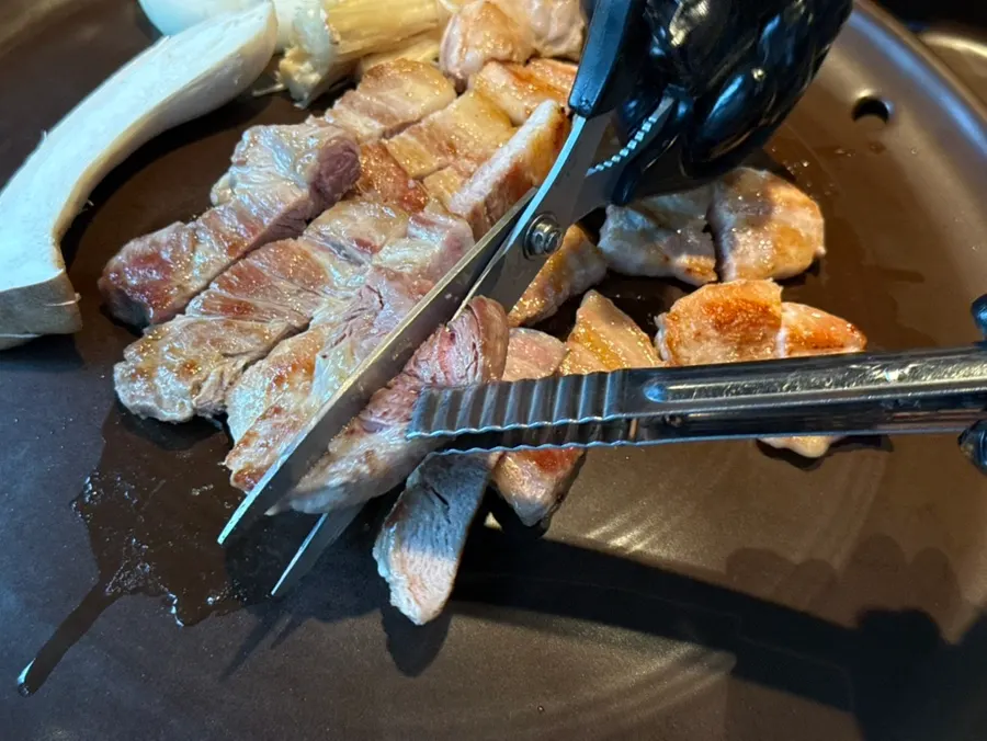 Meat grilled by a staff member