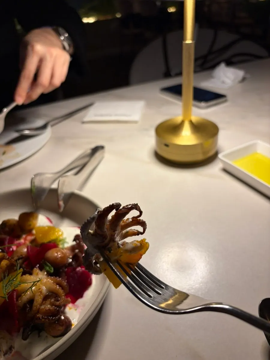 Plump octopus with potato and orange