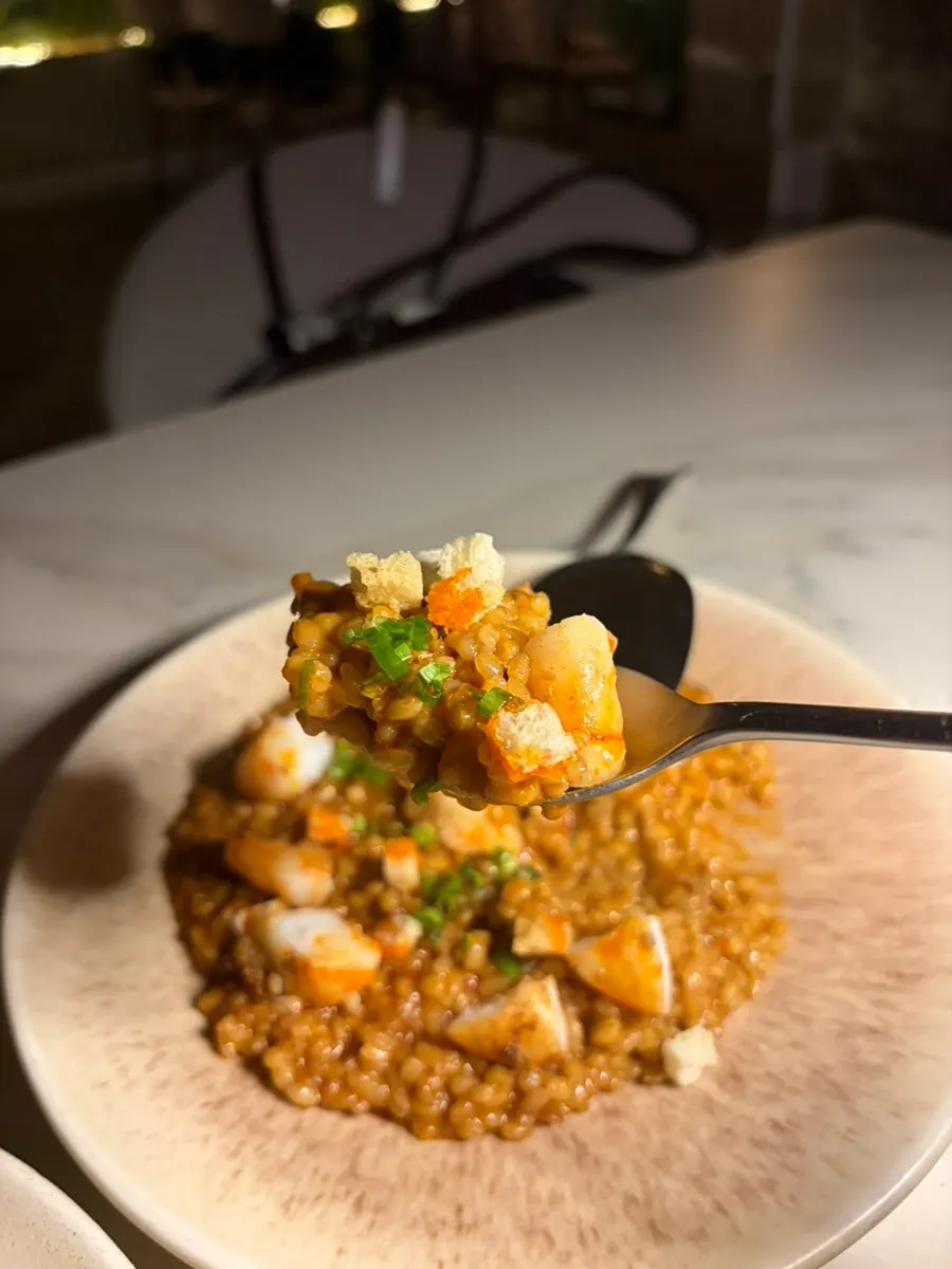 A spoonful of spicy shrimp bisque risotto