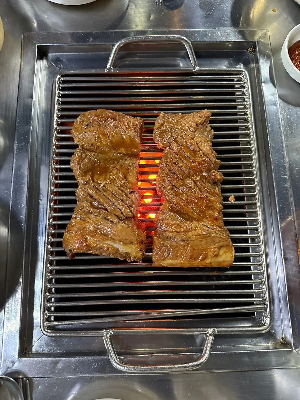Pork king ribs served in a metal bowl