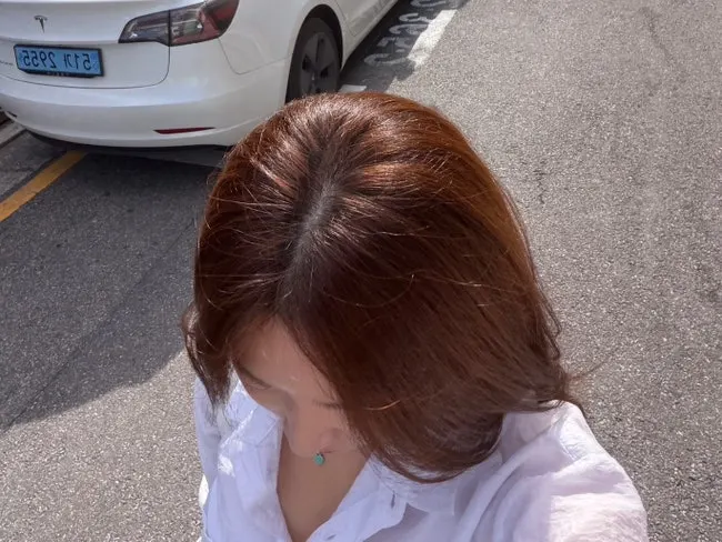 Hair with yellow tones showing after summer dye faded