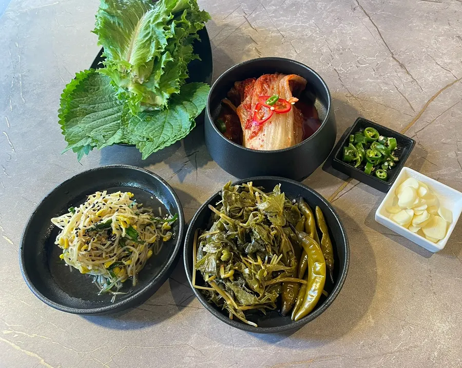 Angelica pickles and side dishes served with meat