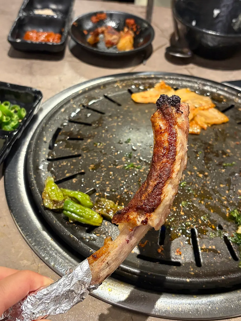 Bone pork belly lettuce wrap with grilled kimchi