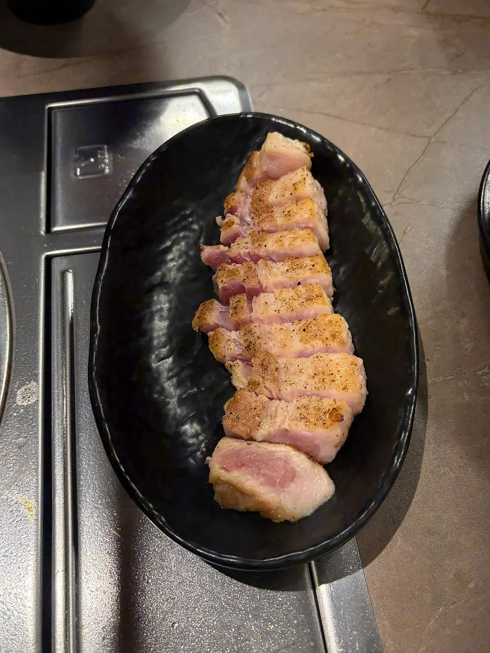 Foil-wrapped bone section of bone pork belly