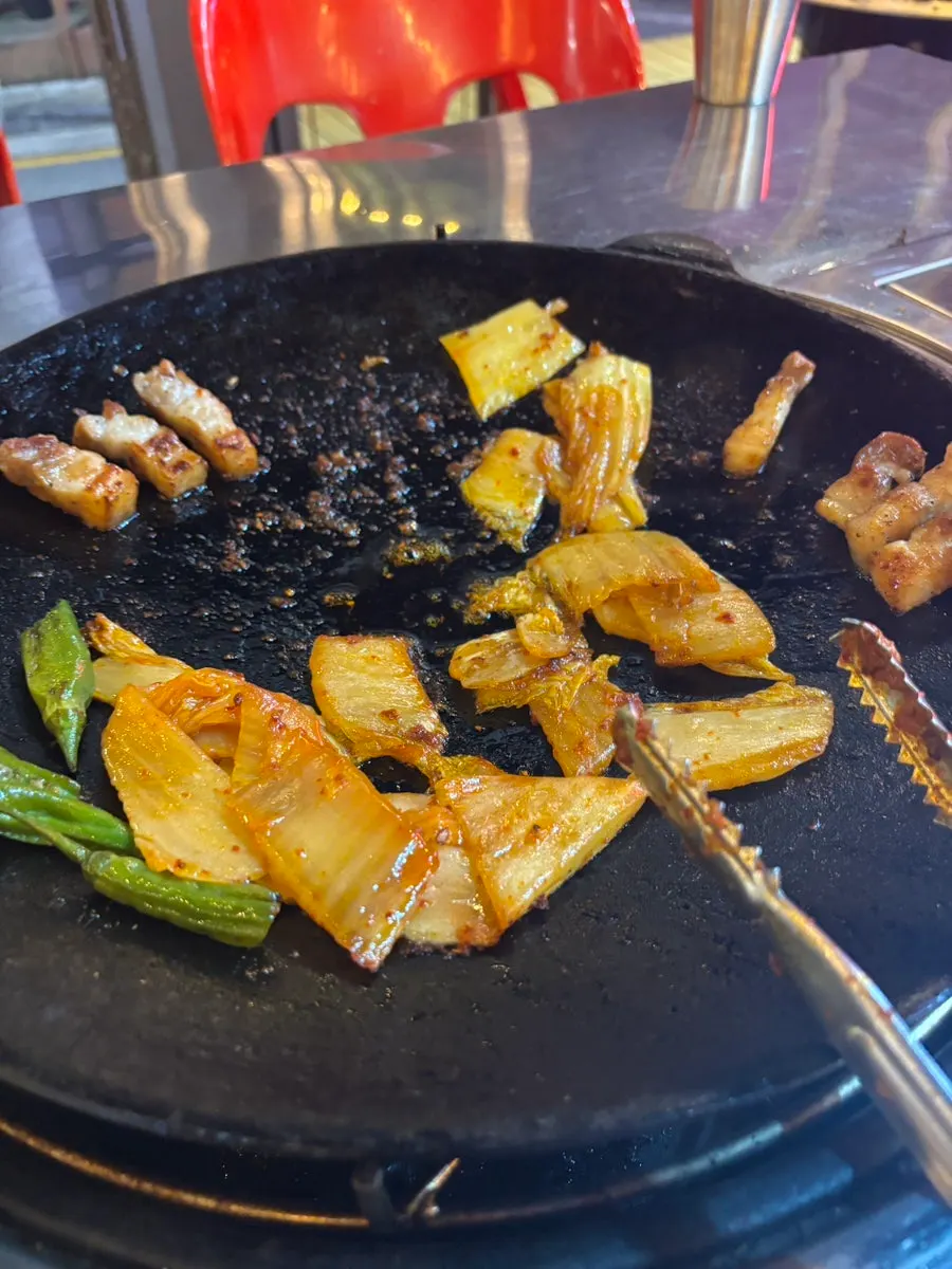 Chobeoljip's pork belly sizzling on the griddle