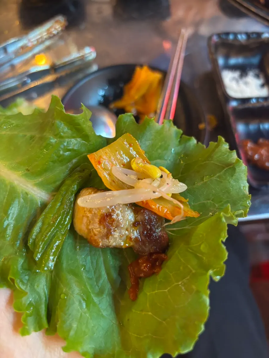 Grilled shishito-style peppers and pork belly on the griddle