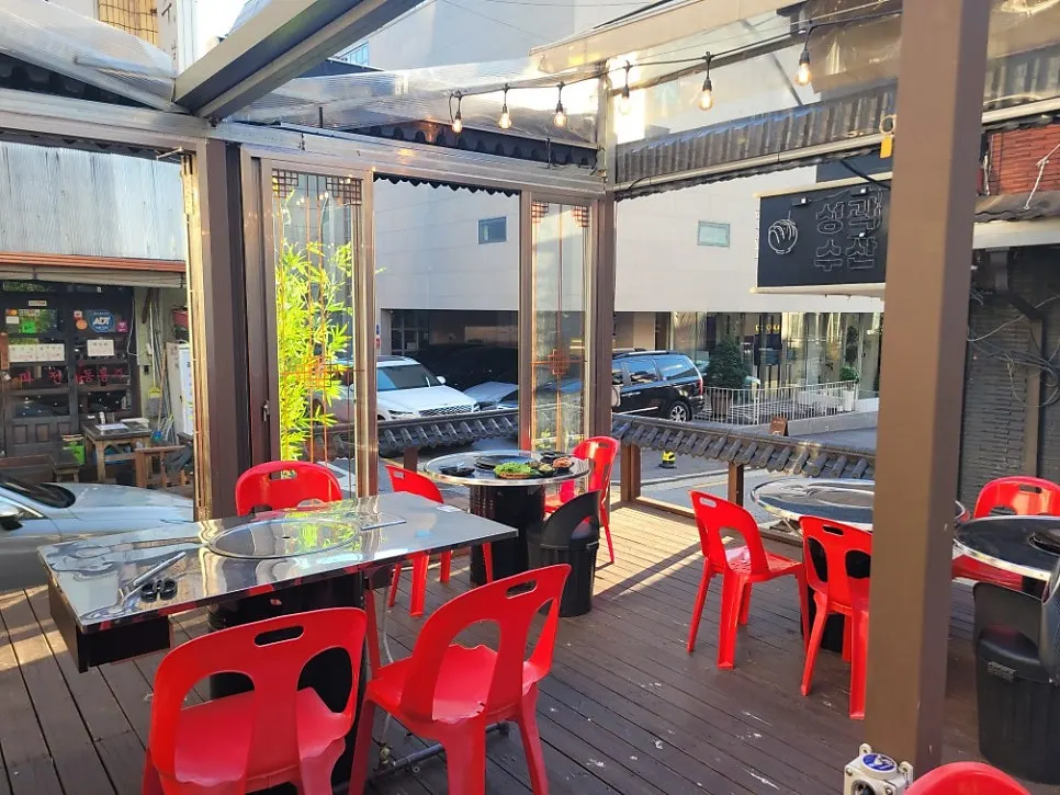 Outdoor tables with red chairs