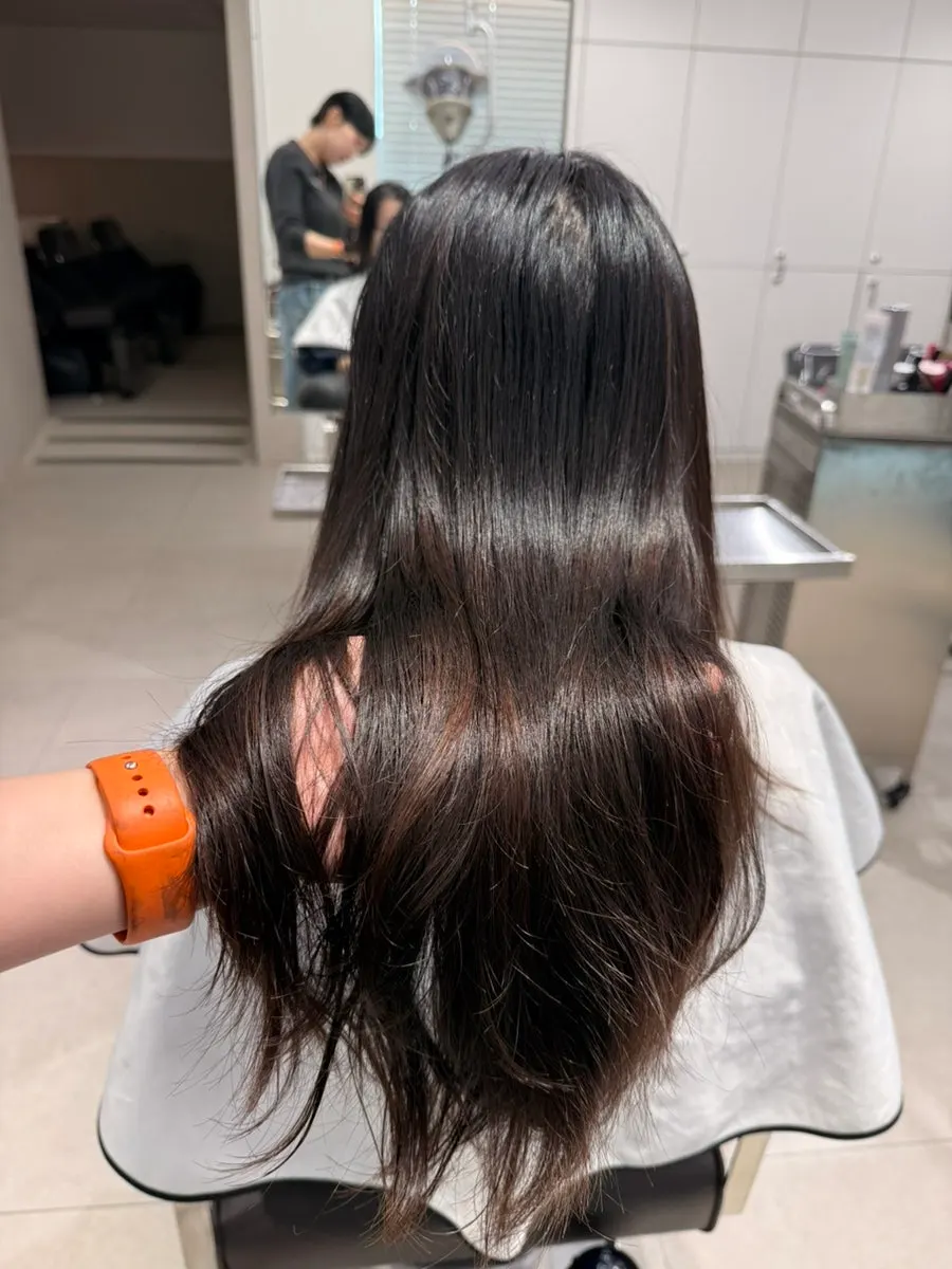 After photo of settled, smoothed-out hair post-clinic