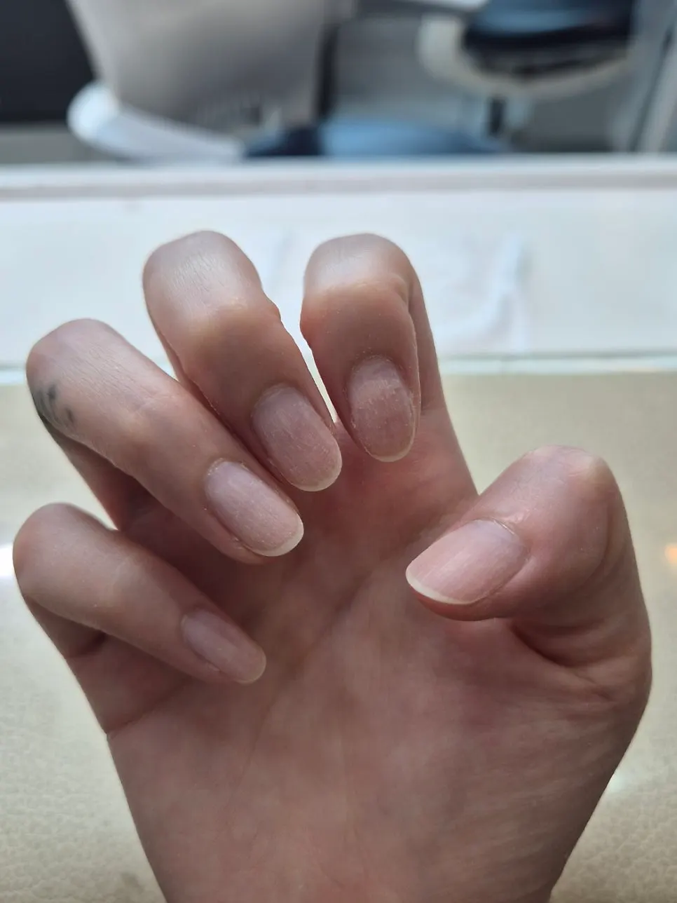 Nails still with old nail polish before the treatment