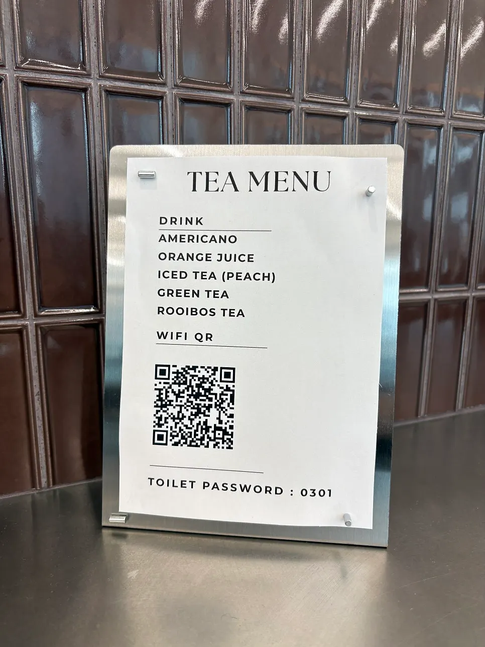 Sign showing drinks offered while waiting