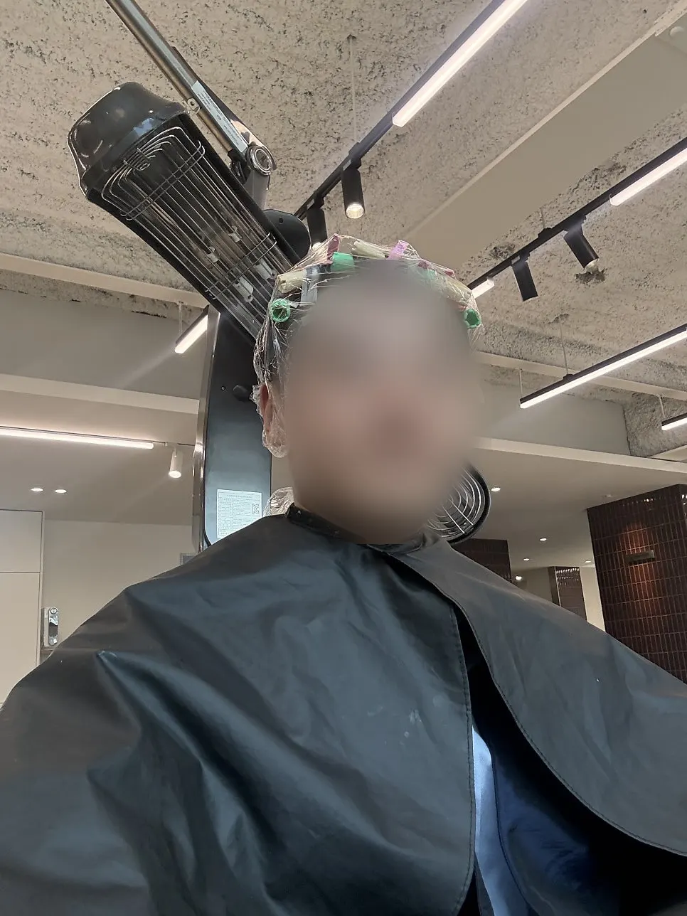 Reflection in the mirror during the perm process
