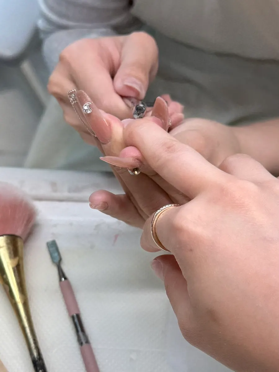 Nail cleanup with an electric drill during treatment