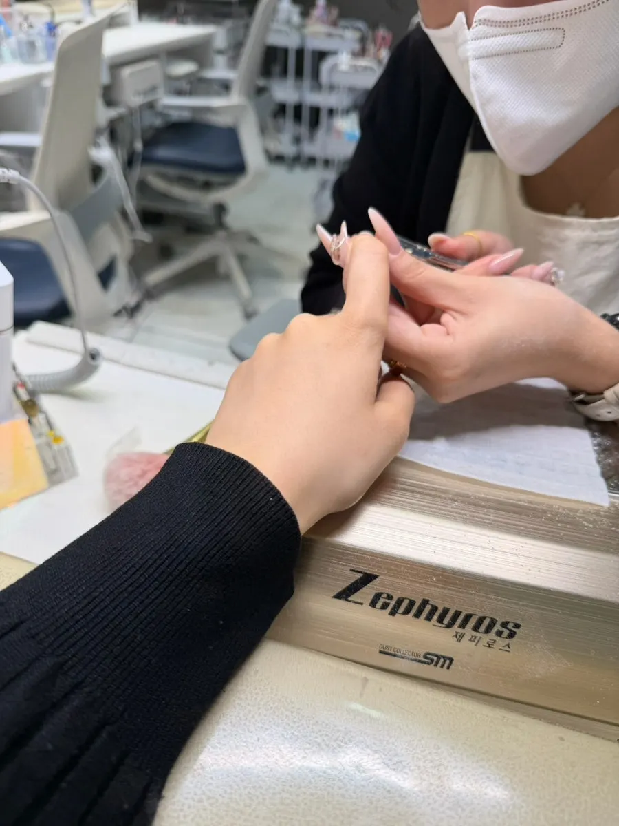 Hand receiving cuticle care