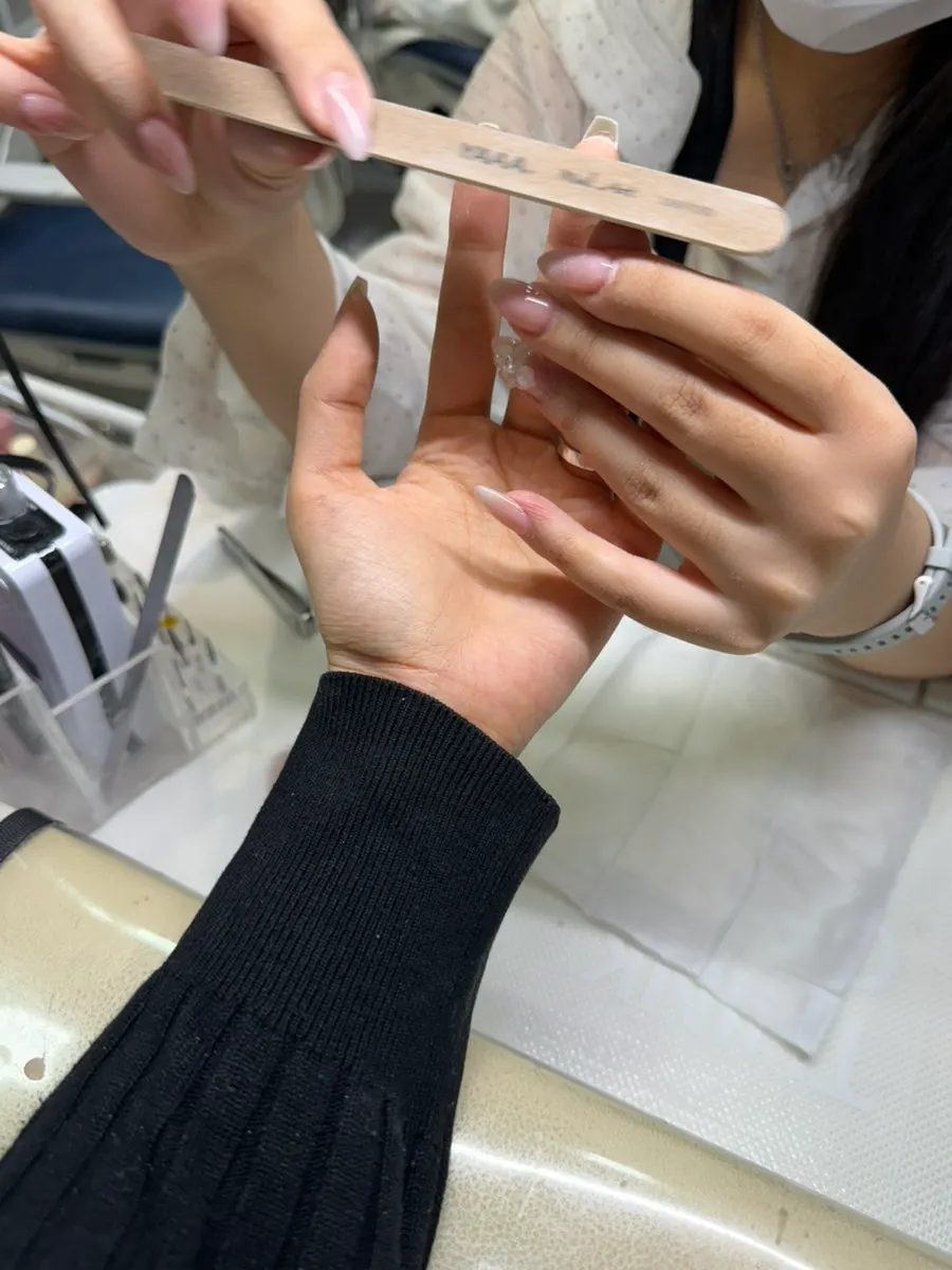 Coffin-shaped nails with base gel applied