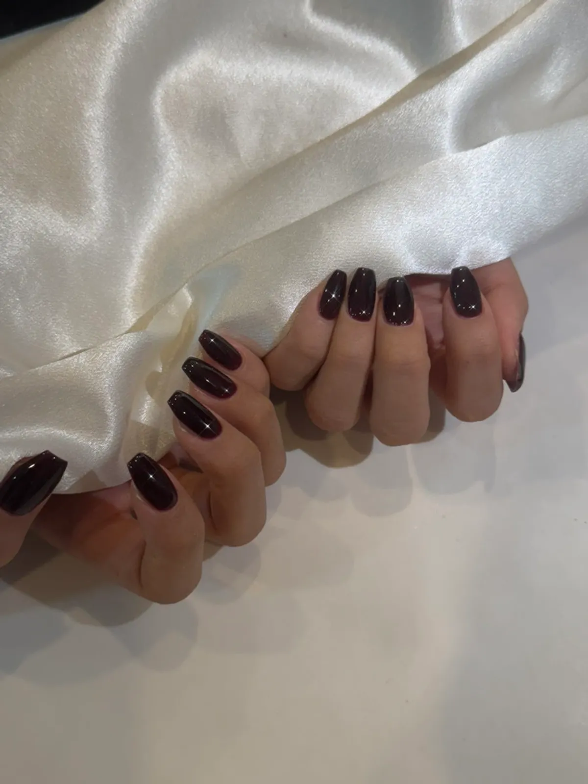 Finished burgundy-brown coffin nails in the 'Vampire' color